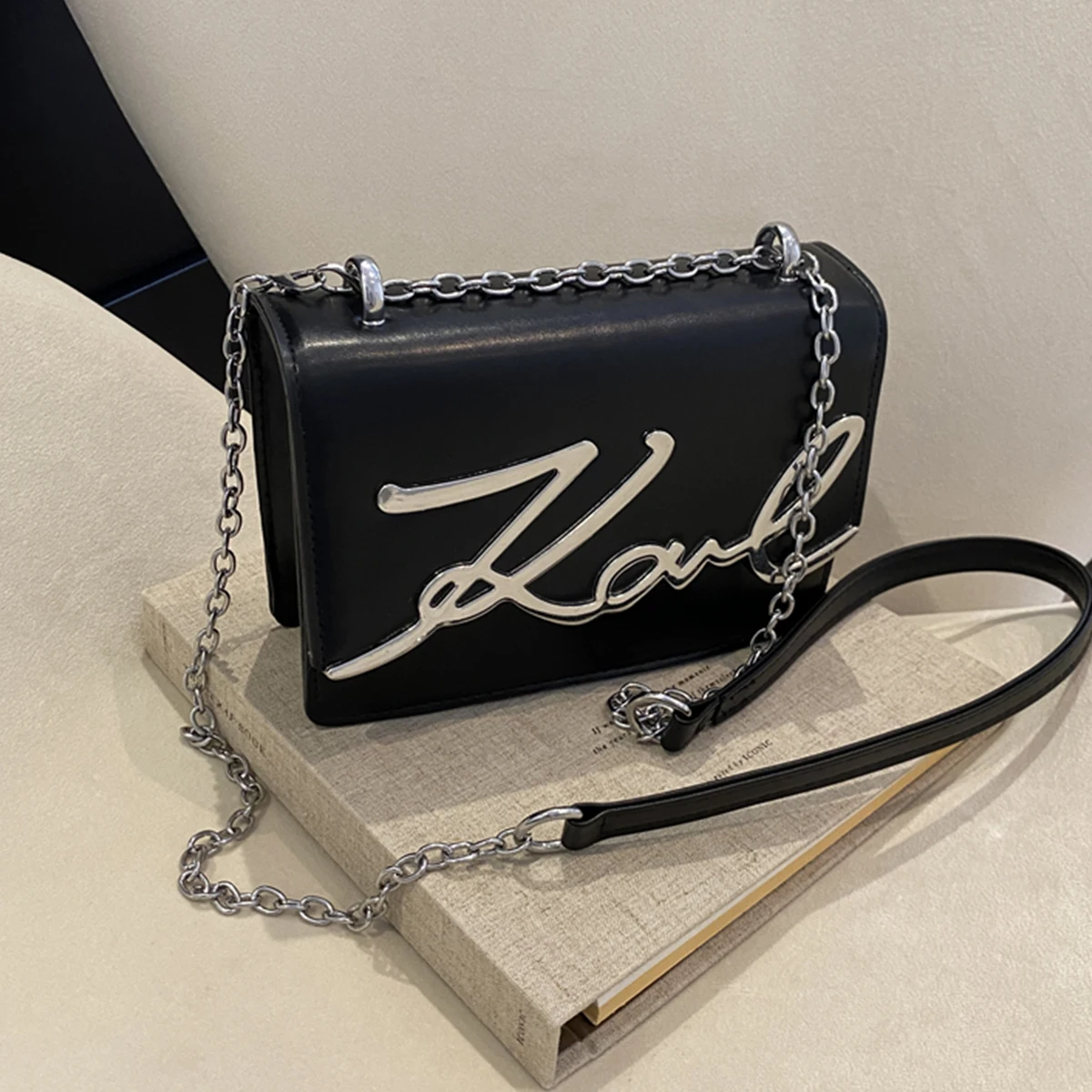 kf-S9664fa89b0214ec99dbc866c98b48c4fZ Fashionable Crossbody Bag Solid Color Shoulder Bag Metal Letter Logo ChainLink Strap Featuring Magnetic Button for Daily Use - Image 1